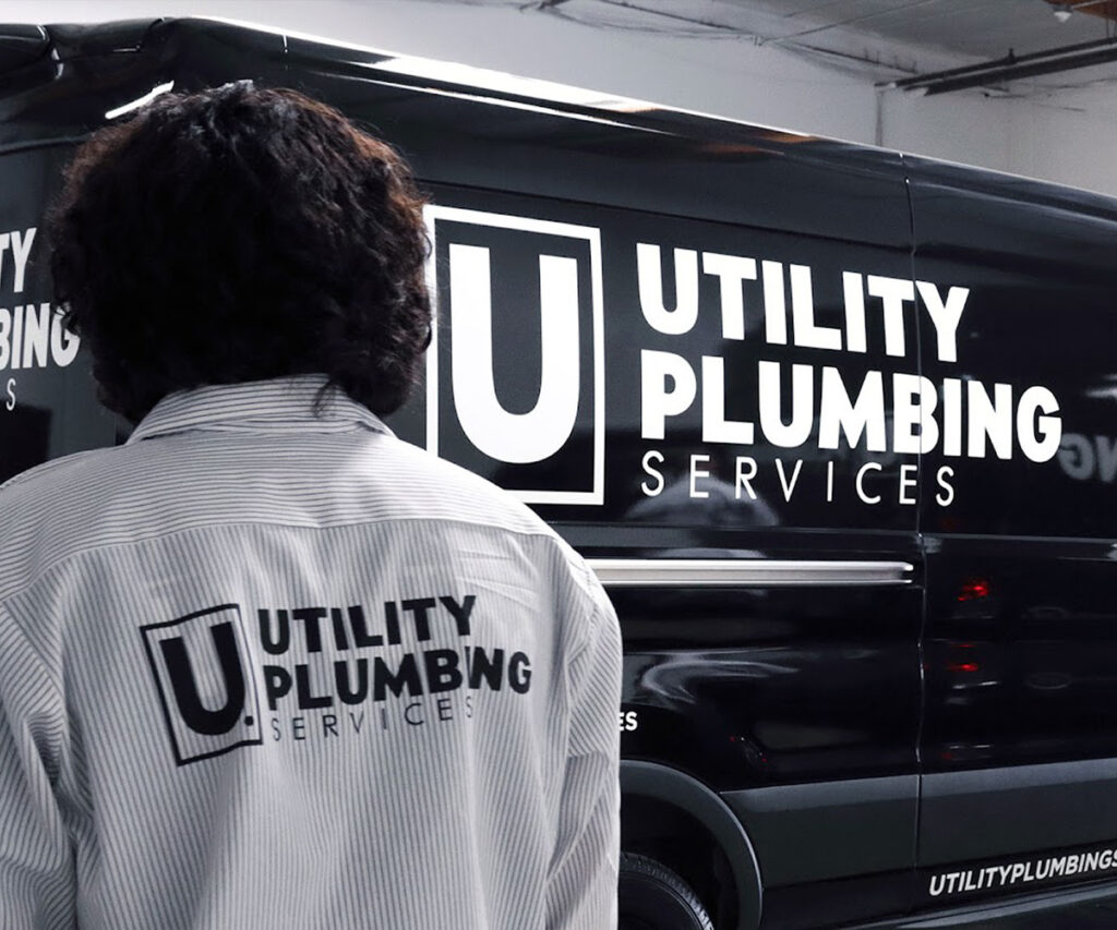 Hydro Jetting in Montclair: The Ultimate Drain Cleaning Solution 7 Utility plumber branded back shirt shot