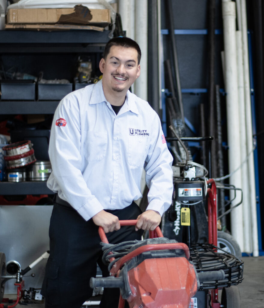 Trenchless Reinstatements Rancho Cucamonga 9 Utility Plumber smiling while operating plumbing equipment